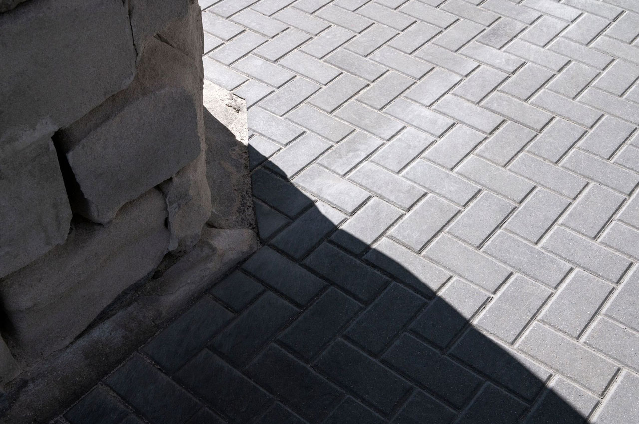 Well-structured concrete paver path demonstrating geometric patterns and robust construction, providing durable pedestrian access.